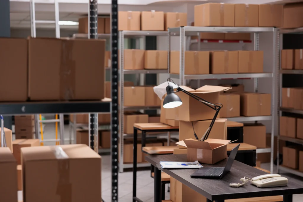 Empty storehouse delivery department with nobody it full with rows shelves with carton boxes ready workers start preparing packages interior heavy industry manufacturing factory 1024x683