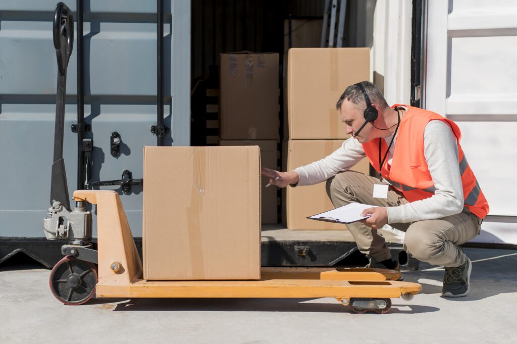 Full shot man with pallet truck 1024x681